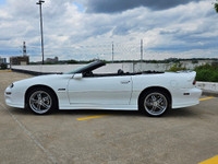Unleash raw American muscle this summer with this stunning 2002 Chevrolet Camaro Z28 Convertible. Po... (image 3)
