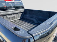 This 2025 GMC Canyon in Onyx Black is equipped with 4WD and Turbocharged Gas I4 2.7L/ engine. The GM... (image 9)
