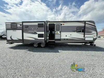 Palomino offers the Puma 32-DBKS travel trailer with a rear bunkhouse, triple slide outs and an opti...