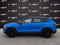 The 2024 Volkswagen Taos Comfortline Black Edition AWD blends turbocharged performance with bold bla... (image 1)