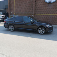 This 2019 Volkswagen Jetta is a stylish sedan with a sleek black exterior and dual tone black and pe... (image 3)