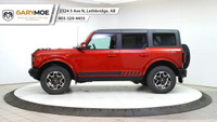 Experience the power and style of the red 2023 Ford Bronco Outer Banks 4 Door Advanced 4x4, boasting... (image 1)