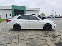 2014 Subaru WRX STI with the 6-speed manual and only 116,000kms! Vehicle comes safety certified! Two... (image 3)