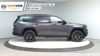 The 2025 Jeep Grand Cherokee L Limited 4x4, in a sophisticated gray, is designed to offer a commandi... (image 5)