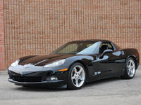 This isn’t just a car—it’s a statement. Draped in sleek black-on-black with polished chrome wheels t... (image 2)