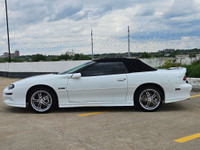 Unleash raw American muscle this summer with this stunning 2002 Chevrolet Camaro Z28 Convertible. Po... (image 4)