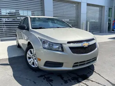 The 2014 Chevrolet Cruze 1LS offers a practical and efficient driving experience in a compact sedan....