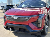 Finished in a head-turning Radiant Red Tricoat with a sleek Noir interior, the 2025 Cadillac Optiq E... (image 2)