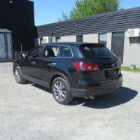 Explore the 2015 Mazda CX-9 Grand Touring AWD a spacious three-row crossover SUV with a powerful 3.7... (image 4)