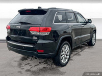 This Grand Cherokee features leather-trimmed, ventilated front seats, heated front and rear seats, p... (image 5)