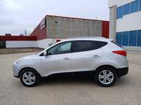 Drive with confidence in this 2011 Hyundai Tucson! With its spacious interior, smooth handling, and... (image 7)