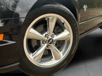 Experience the perfect blend of performance and bold design with this 2009 Ford Mustang GT Convertib... (image 1)