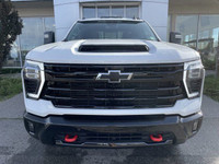 The 2025 Chevrolet Silverado 3500 LT in Summit White is a powerful and capable heavy-duty pickup tru... (image 1)