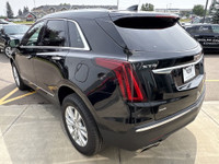 The 2024 Cadillac XT5 Luxury in Stellar Black Metallic combines refined styling with practical perfo... (image 5)