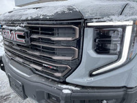 The 2025 GMC Sierra 1500 AT4X in Thunderstorm Grey Metallic is a formidable off-road truck that seam... (image 2)