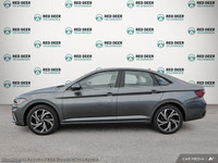 The 2025 Volkswagen Jetta Highline in a sophisticated gray hue comes equipped with a front-wheel dri... (image 2)