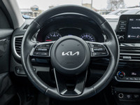 Experience the sleek and stylish 2023 Kia Seltos EX, a compact SUV perfect for navigating city stree... (image 9)