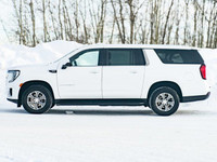 The *2023 GMC Yukon XL SLE 4WD Sport Utility* is the ideal combination of *luxury, utility, and perf... (image 4)