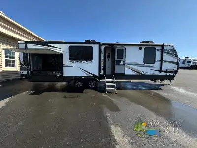 Keystone Outback travel trailer 330RL highlights: Rear Living Area Sofa Sleeper Triple Slides Kitche...