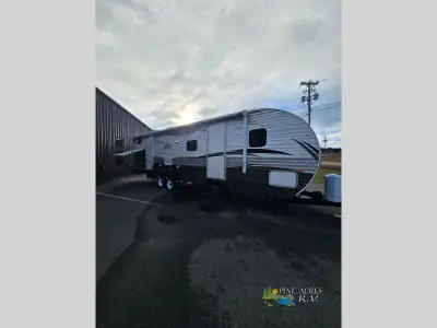 This travel trailer weighs 7270lbs and features 2 slides, outside kitchen, front queen bedroom, brig...