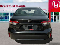 This sleek 2022 Toyota Corolla LE sedan in Black Sand Pearl is ready to enhance your daily commute.... (image 4)