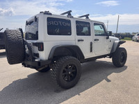 2013 Jeep Wrangler Unlimited Sahara 4x4 for sale at Pacific Motors near Winnipeg, MB DISCLAIMER: THI... (image 5)
