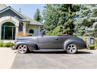 This 1940 Chevrolet Special Deluxe Cabriolet is powered by a LT1 5.7L V8 fuel injected engine that i... (image 1)