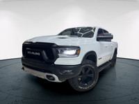 The 2022 Ram 1500 Rebel 4x4 Crew Cab 57 Box in stunning white lets you command every road with confi... (image 2)