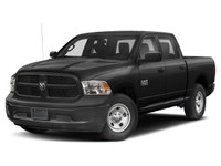 The 2021 Ram 1500 Classic Express 4x4 Crew Cab 57 Box is a bold black truck with an impressive 44 dr... (image 1)