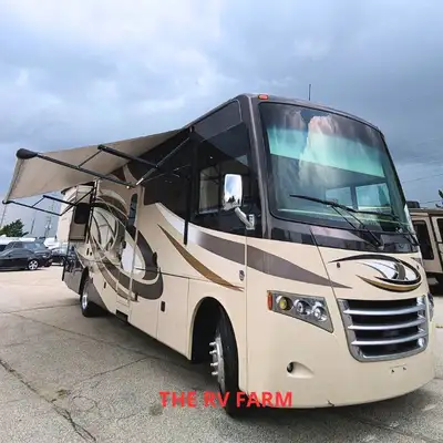 Experience luxury and freedom on the open road with the 2015 Thor Miramar 34.3, a top-of-the-line Cl...