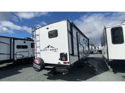 EAST TO WEST Alta travel trailer 2600KRB highlights: Wardrobe/Pantry King Bed Booth Dinette Pet Dish...