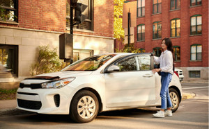 Lady getting into her car in the city