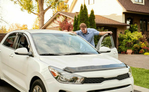 Young driver prepares the sale of his car. 