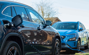 Two electric E cars on charge charging from home. Compare two electric cars. 