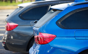 Close-up of the back of two SUVs. Midsize SUV comparison. 