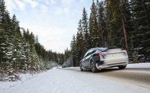 Best AWD sports car - Car driving in the forest with snow