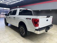 Experience the power and versatility of the 2022 Ford F-150 XLT 4WD SuperCrew, a white powerhouse bu... (image 9)