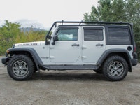 The 2018 Jeep Wrangler JK Unlimited Rubicon in stunning white with an all-wheel-drive system invites... (image 3)