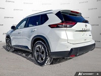 The 2024 Nissan Rogue SV Moonroof, in brilliant white, offers an elevated driving experience with on... (image 3)