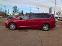 The 2026 Chrysler Grand Caravan SXT in Red Hot Pearl with a Black interior offers a bold look, spaci... (image 2)
