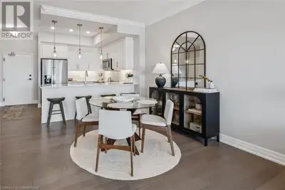 Welcome to 1010-1880 Gordon St, elegant 1-bdrm + den condo perched high above Guelph’s sought-after...