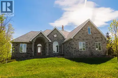 Welcome to this executive-style, custom-built stone bungalow that perfectly blends luxury living wit...