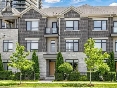 MODERN. ELEGANT. MOVE-IN READY. Welcome to this beautifully upgraded executive townhouse in the pres...