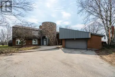 This unique, large family home was custom built in 1971, and provides both a town and country feel....
