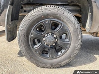 The 2016 Ram 2500 Laramie, finished in an elegant black exterior paired with a sophisticated black i... (image 5)