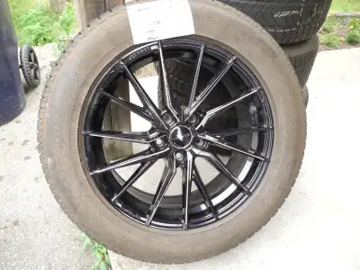 Here I have a Set of 4 Manzinni Alum. Rims with 235/60 R18 Pirelli Tires. They are in excellent Cond...