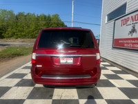 A spacious family minivan with comfortable seating, convenient features, and versatile cargo space,... (image 4)