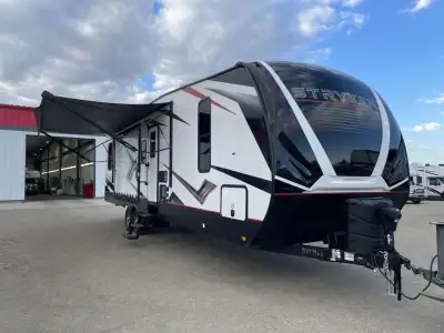Cruiser Stryker toy hauler STG3212 highlights: Side Patio 12' 11in.in. Garage Three Burner Cooktop K...