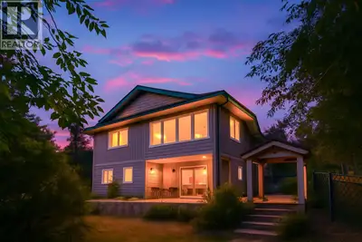 Loon Lake retreat living at its best. Set on a generous .64-acre lot, this beautifully kept and thou...