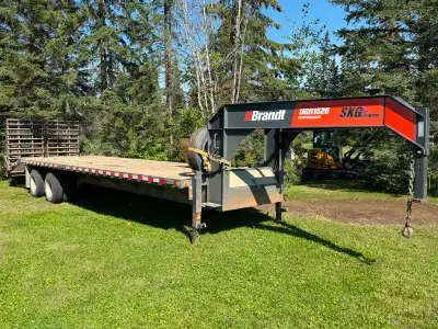 Original owner. 15 Ton Tandem Axle Gooseneck trailer. Full width ramps. Spare tire. Mud flaps. Deck...